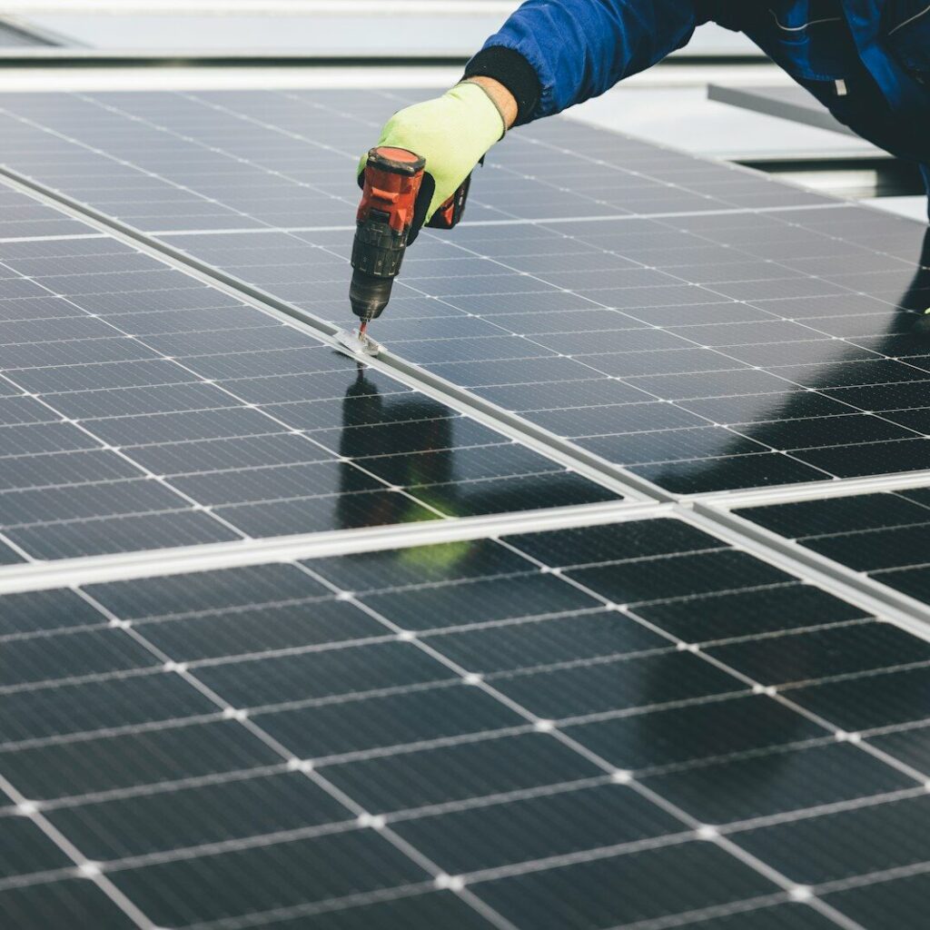 a person working on a solar panel